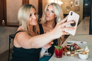 Two friends having a great time at a party